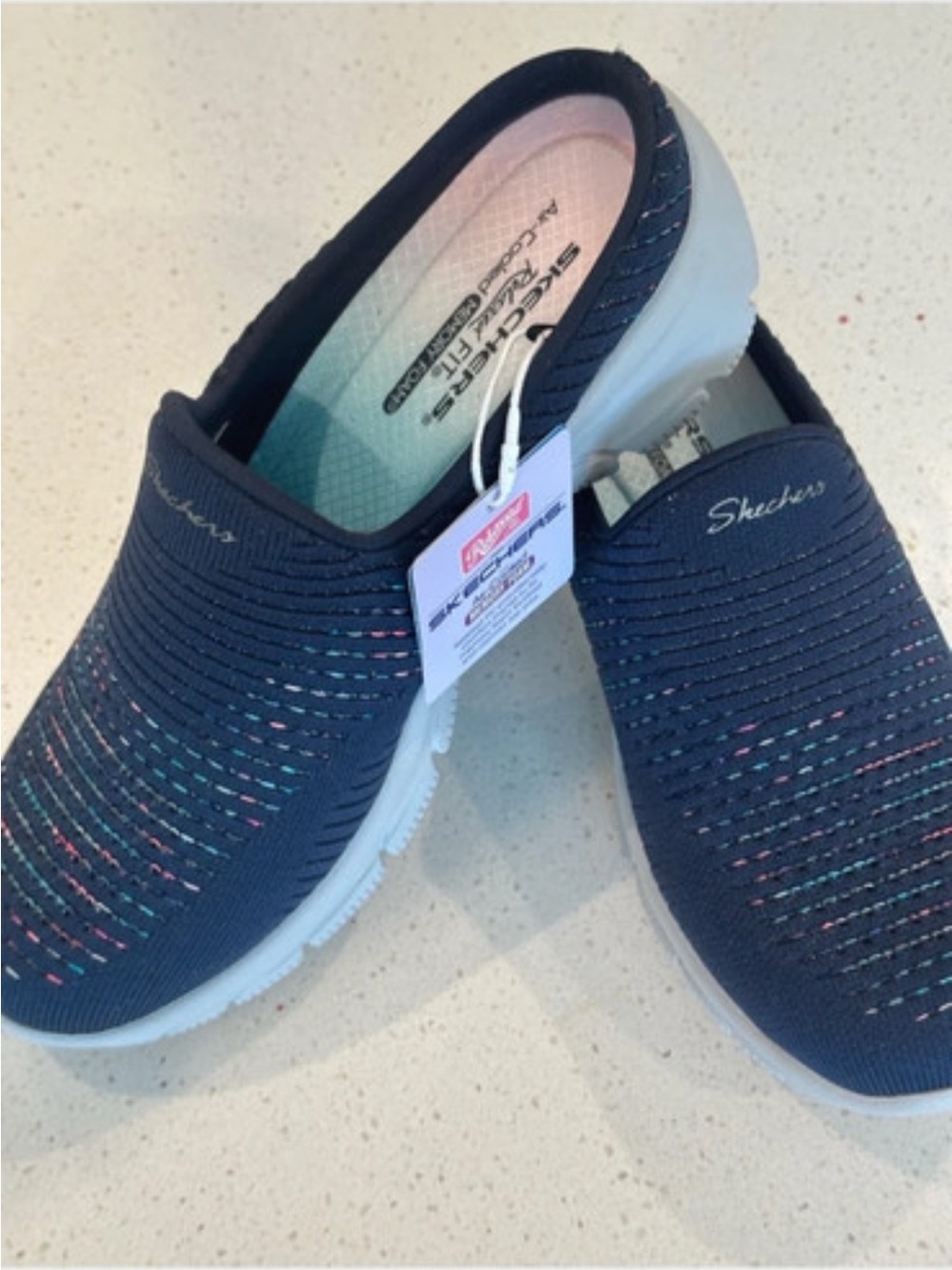 Skechers Navy Slip-On Knit sneakers with Multicolor Accents fit like a 6.5
